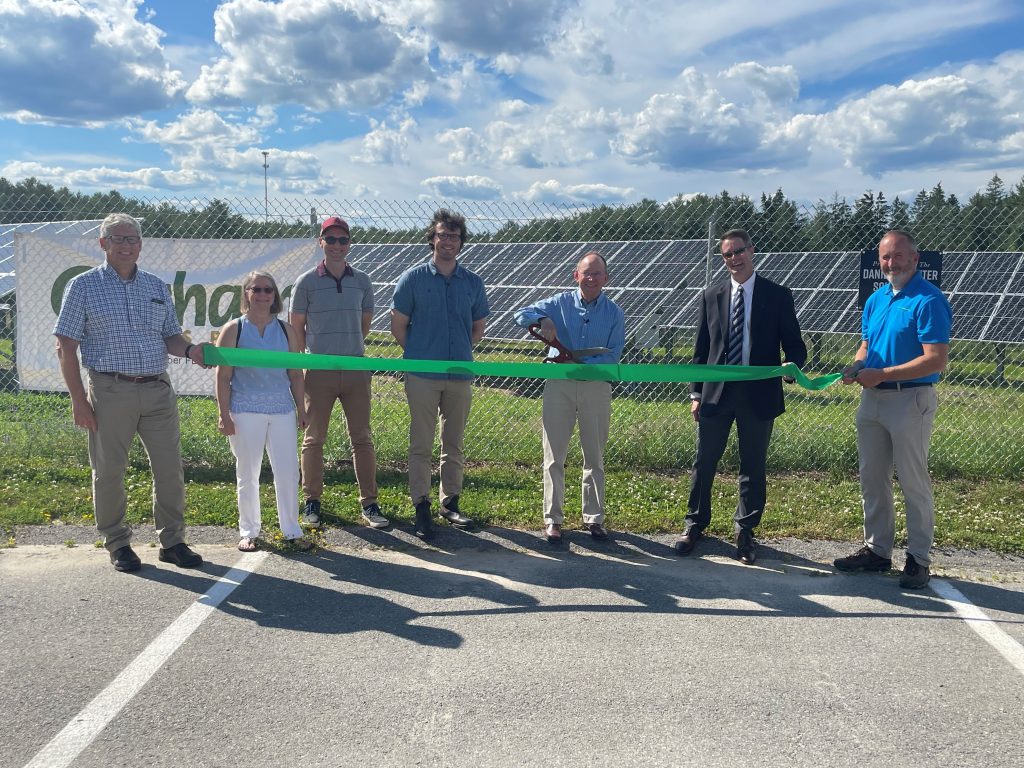 GSB staff poses at ribbon cutting for new solar farm
