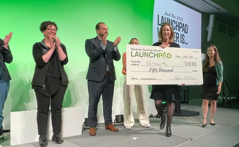 2022 LaunchPad $50,000 Winner Tanbark Accepting Check